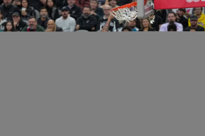 Dec 13, 2023; San Antonio, Texas, USA; Los Angeles Lakers forward Anthony Davis (3) dunks in front of San Antonio Spurs center Victor Wembanyama (1) and forward Keldon Johnson (3) in the first half at the Frost Bank Center.